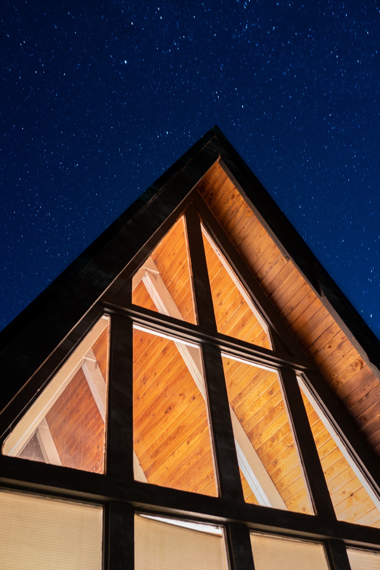 A-frame cabin under stars